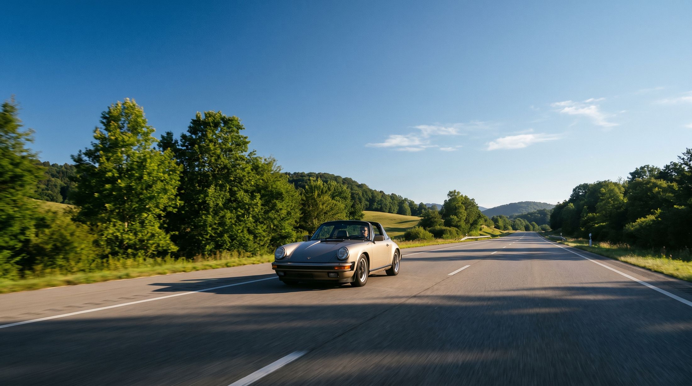 A car on an open highway on a clear morning
